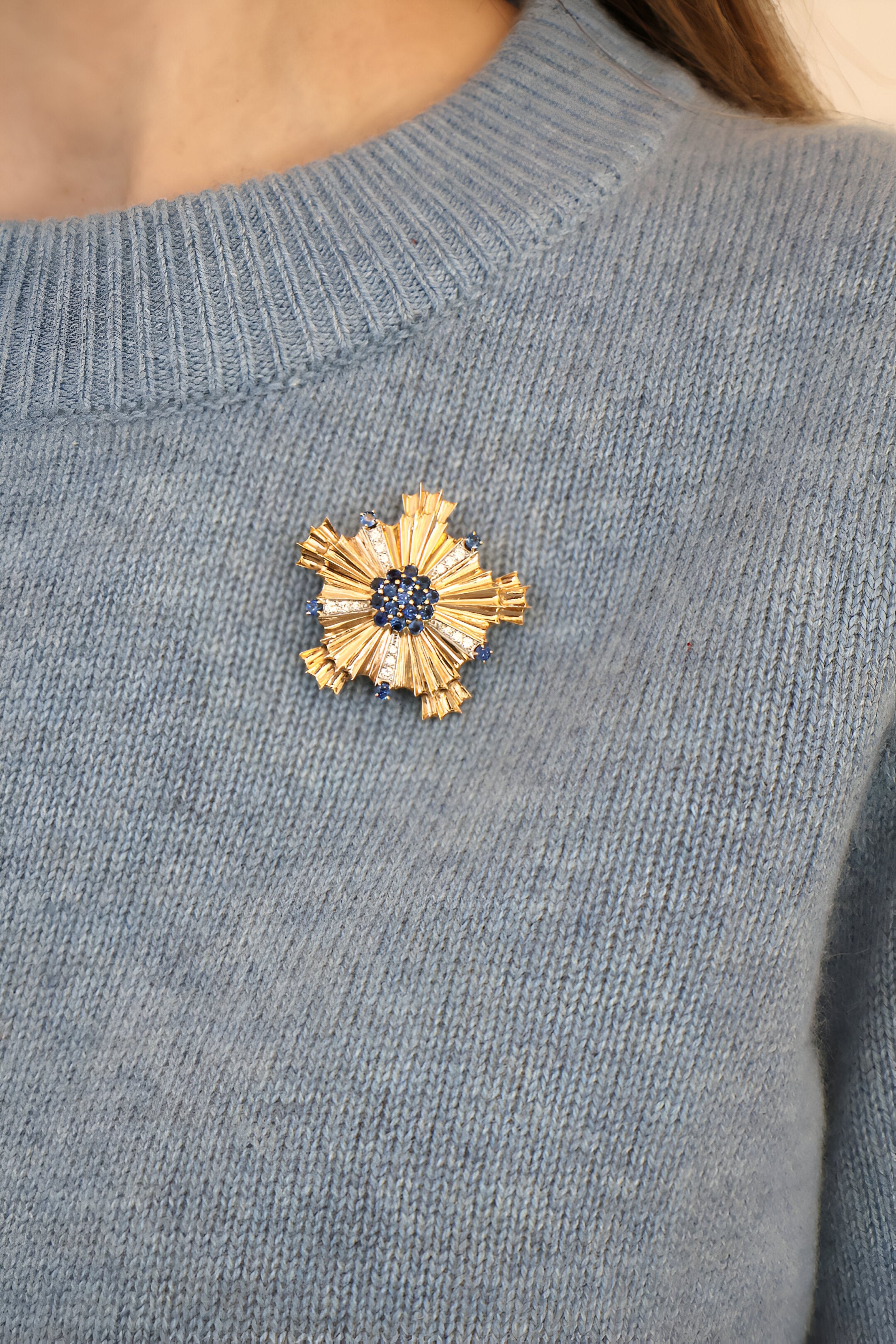 Tiffany retro sapphire and diamond brooch onblue sweater
