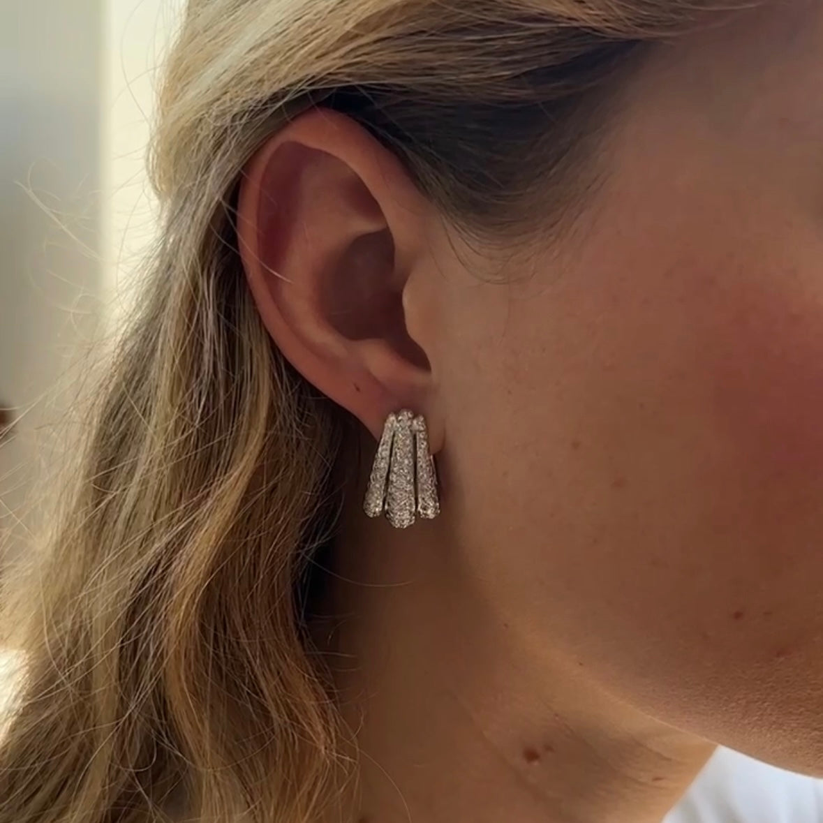 vintage 18kt white gold and diamond hoops on ear