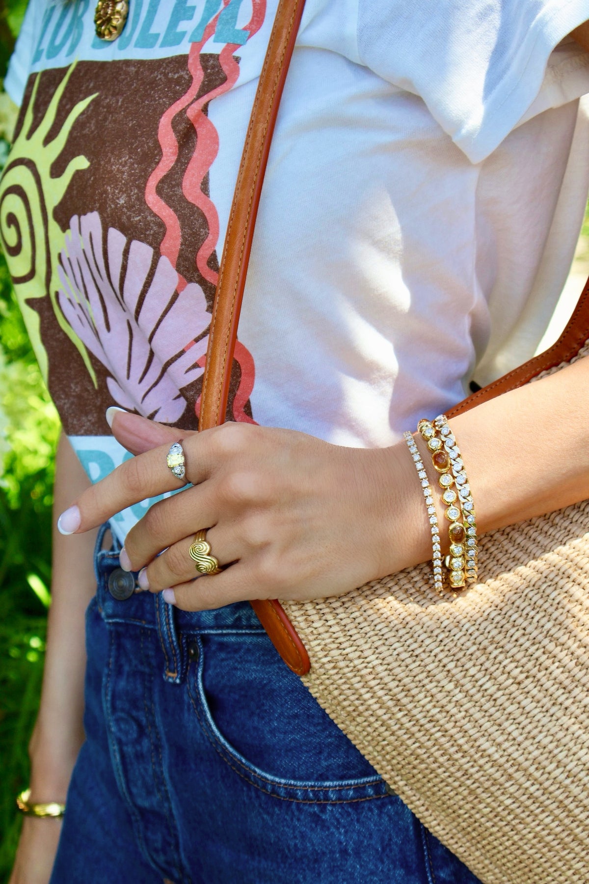 Tiffany & Co 18kt Yellow Gold Swirl Ring layered with yellow diamond ring and vintage tennis bracelets