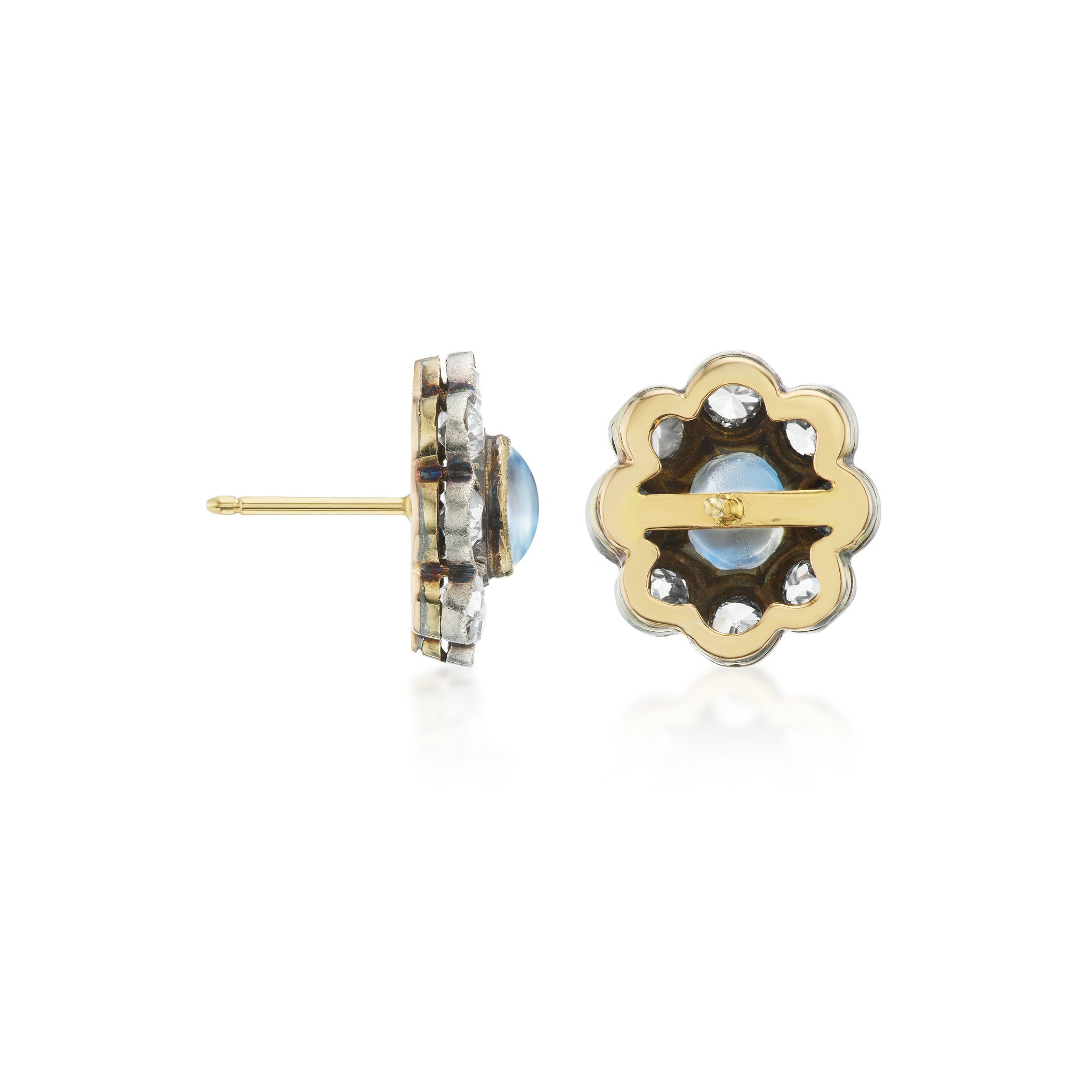 Antique earrings featuring lively bezel-set moonstones, with old mine-cut diamonds in a halo surround, set in silver topped gold. Side and back view.