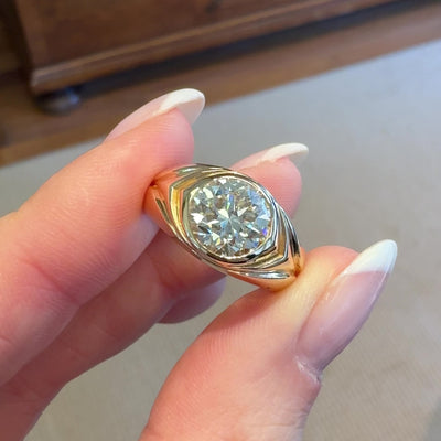 18kt yellow gold round diamond ring, video of woman holding ring