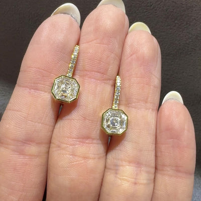 18kt yellow gold diamond drop earrings, video in woman's hand